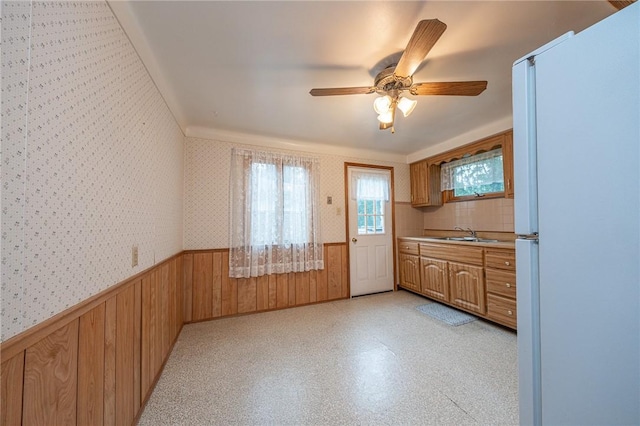 246 Maple Dr, Monroeville, PA 15146 - kitchen with freestanding refrigerator, wainscoting, wallpapered walls, a ceiling fan, and light countertops