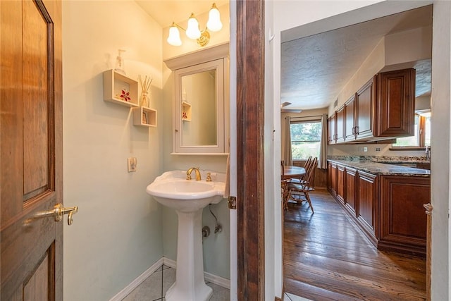 315 Pennsylvania Ave, Plum Boro, PA 15147 - bathroom featuring baseboards and wood finished floors