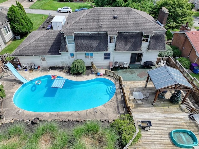 315 Pennsylvania Ave, Plum Boro, PA 15147 - view of swimming pool with a water slide, a fenced backyard, a deck, and entry steps
