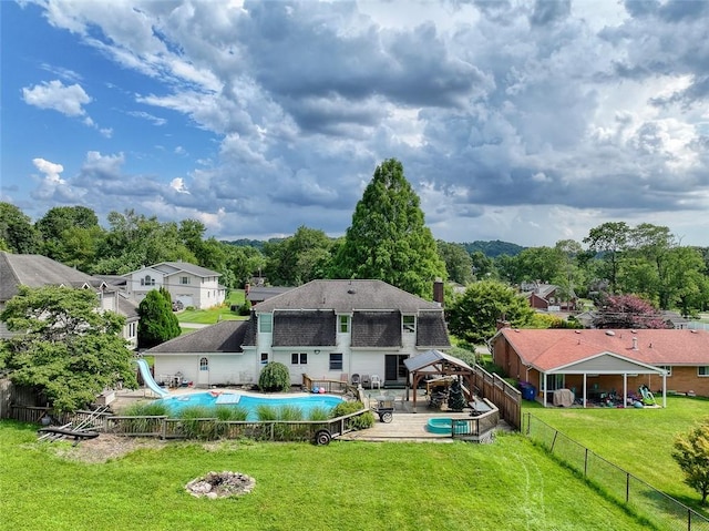 315 Pennsylvania Ave, Plum Boro, PA 15147 - back of property with a fenced backyard, a patio, a chimney, a residential view, and a shingled roof