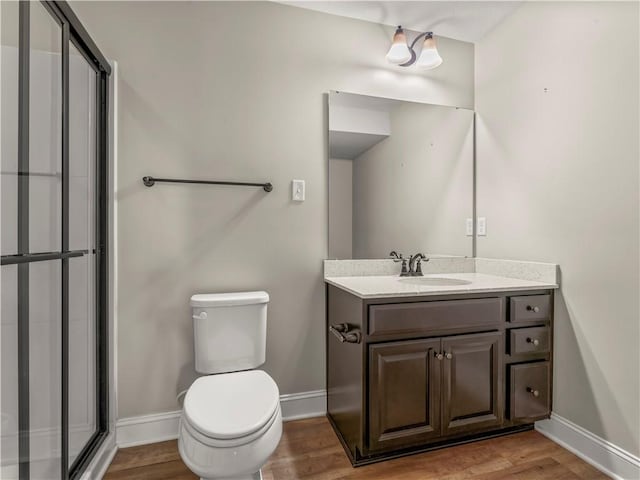 4402 Walnut Ridge Cir, South Fayette, PA 15057 - bathroom with wood finished floors, vanity, and a shower with shower door