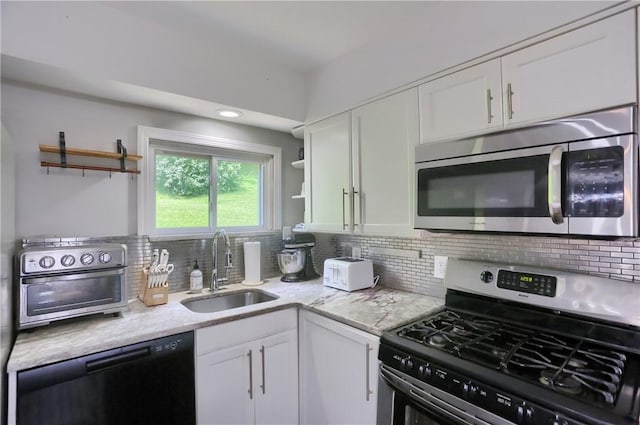866 Connolly Ave, South Park, PA 15236 - kitchen with appliances with stainless steel finishes, open shelves, white cabinets, and decorative backsplash