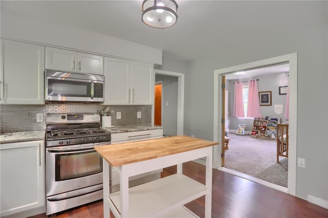 866 Connolly Ave, South Park, PA 15236 - kitchen featuring appliances with stainless steel finishes, butcher block countertops, backsplash, white cabinetry, and dark wood finished floors