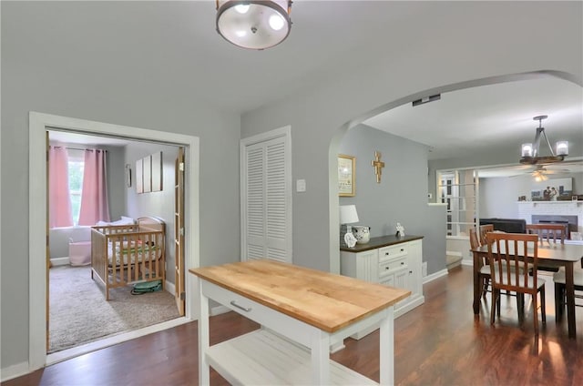 866 Connolly Ave, South Park, PA 15236 - dining area featuring arched walkways, ceiling fan, and dark wood-type flooring