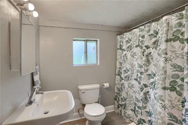 866 Connolly Ave, South Park, PA 15236 - bathroom with wood finished floors and a shower with shower curtain