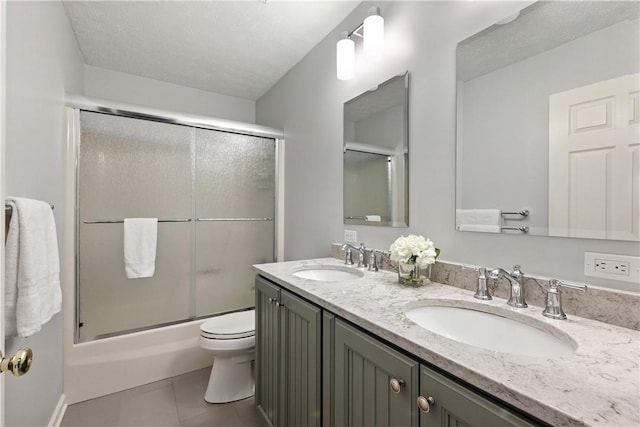 327 Indian Ridge Dr, Moon/Crescent Twp, PA 15108 - full bathroom featuring tile patterned flooring, double vanity, and bath / shower combo with glass door