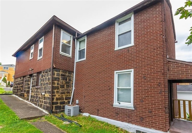 650 Loretta St, Greenfield, PA 15217 - view of side of home with brick siding and a central air condition unit