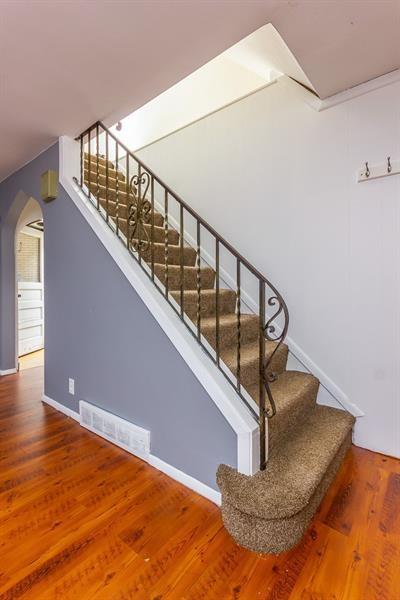650 Loretta St, Greenfield, PA 15217 - stairway featuring arched walkways and wood finished floors