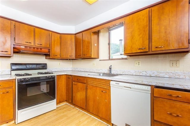 650 Loretta St, Greenfield, PA 15217 - kitchen featuring white appliances, under cabinet range hood, light wood-style floors, and light countertops