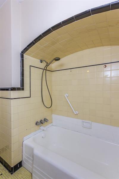 650 Loretta St, Greenfield, PA 15217 - bathroom featuring shower / washtub combination and tile walls