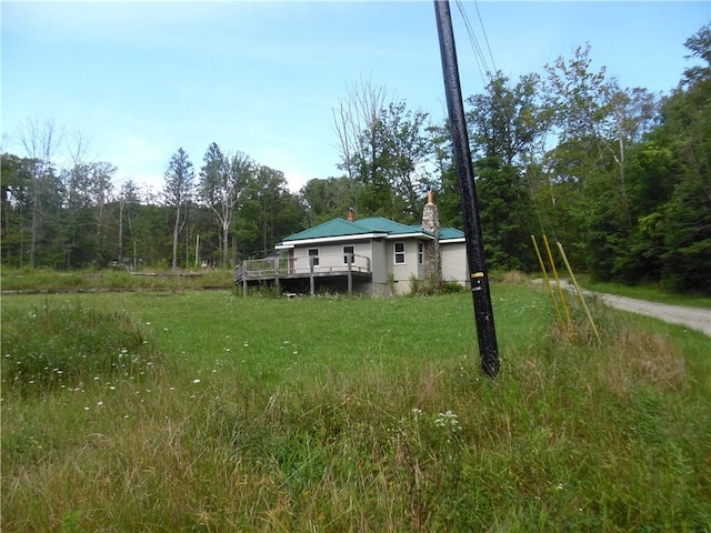 1276 Glades Pike, Somerset, PA 15501 - view of yard featuring a deck and a wooded view