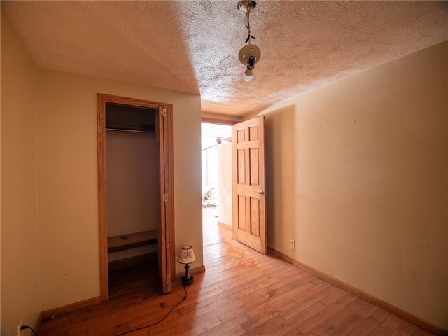 1276 Glades Pike, Somerset, PA 15501 - unfurnished bedroom featuring a textured ceiling, light wood-style flooring, and a closet