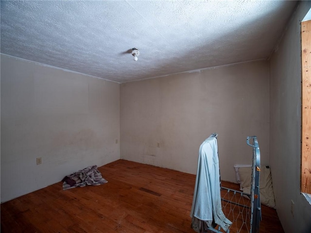 1276 Glades Pike, Somerset, PA 15501 - empty room with wood finished floors and a textured ceiling