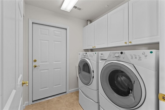 1901 Golf Course Dr, South Strabane, PA 15301 - washroom featuring washing machine and dryer, cabinet space, and light tile patterned flooring