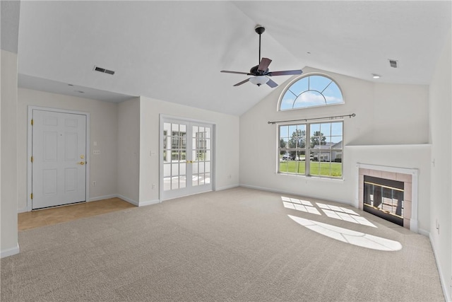 1901 Golf Course Dr, South Strabane, PA 15301 - unfurnished living room with carpet floors, a ceiling fan, a tile fireplace, and high vaulted ceiling