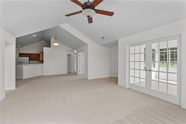 1901 Golf Course Dr, South Strabane, PA 15301 - unfurnished living room featuring french doors, vaulted ceiling, light carpet, and a ceiling fan