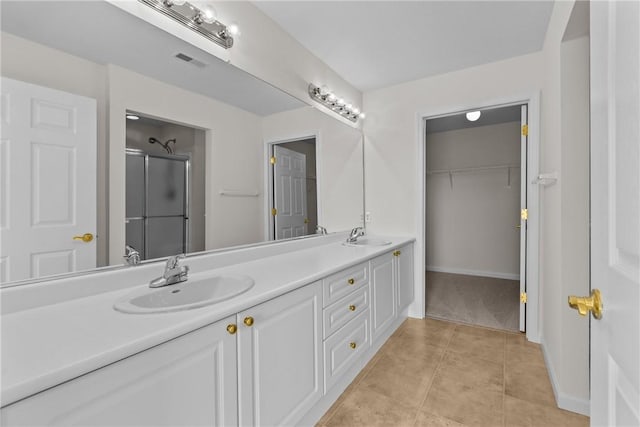 1901 Golf Course Dr, South Strabane, PA 15301 - full bath featuring double vanity, a shower stall, tile patterned floors, and a walk in closet
