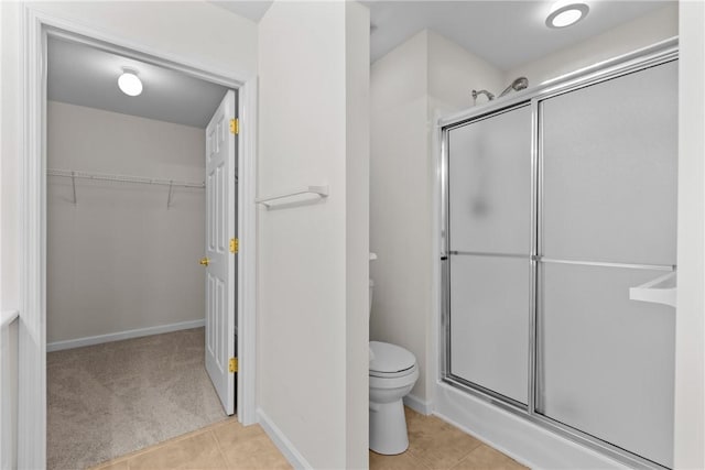 1901 Golf Course Dr, South Strabane, PA 15301 - bathroom with a shower stall, a walk in closet, and tile patterned flooring