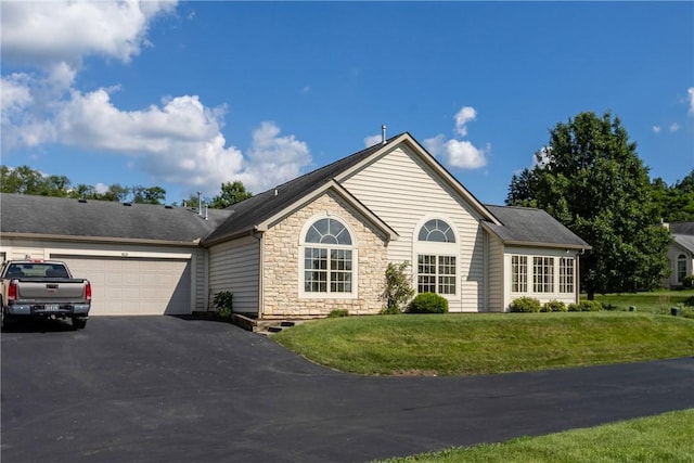 1901 Golf Course Dr, South Strabane, PA 15301 - ranch-style home featuring stone siding, driveway, a garage, and a front yard