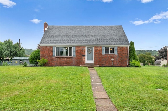 235 Ruth St, Plum Boro, PA 15239 - new england style home with brick siding and a front lawn