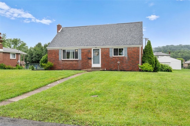 235 Ruth St, Plum Boro, PA 15239 - cape cod-style house featuring brick siding, a front yard, a chimney, and a shingled roof