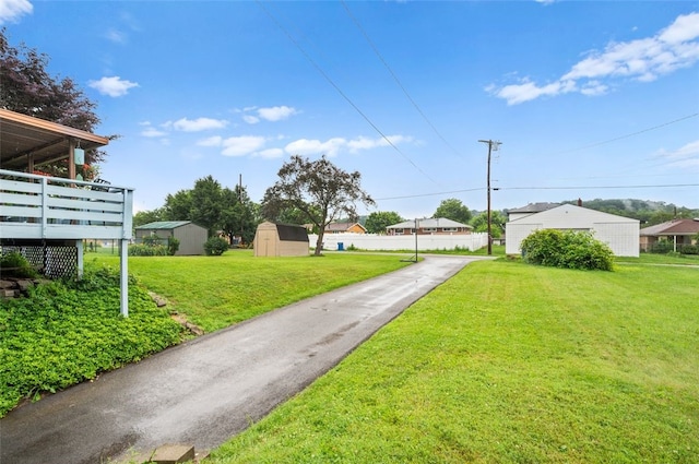 235 Ruth St, Plum Boro, PA 15239 - view of green lawn featuring a shed and a wooden deck