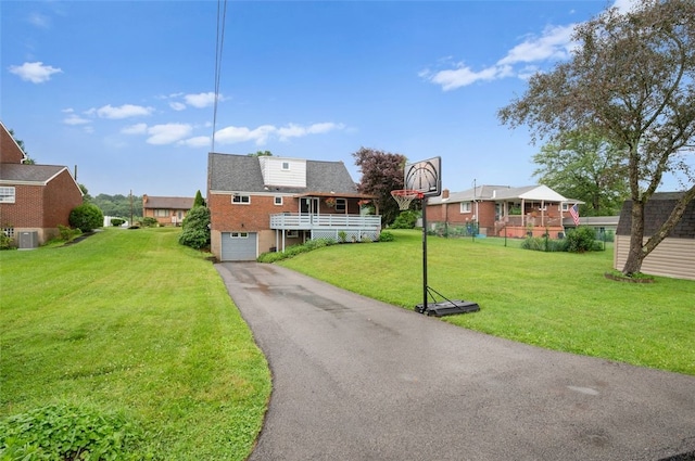 235 Ruth St, Plum Boro, PA 15239 - view of front of home with asphalt driveway, an attached garage, and a front lawn