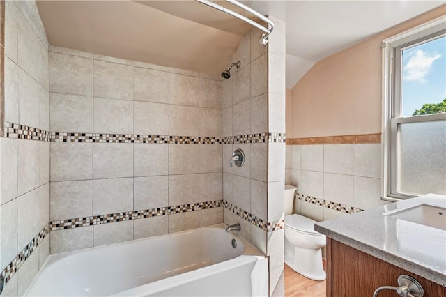 2959 Churchview Ave, Baldwin Boro, PA 15227 - bathroom with vaulted ceiling, tile walls, shower / washtub combination, vanity, and wood finished floors