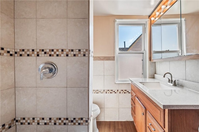 2959 Churchview Ave, Baldwin Boro, PA 15227 - full bath with tile walls, vanity, tiled shower, and wood finished floors