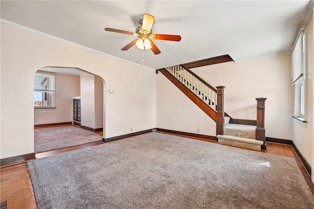 2959 Churchview Ave, Baldwin Boro, PA 15227 - unfurnished living room with arched walkways, ceiling fan, crown molding, stairs, and wood finished floors