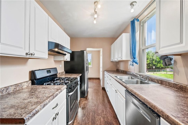 2959 Churchview Ave, Baldwin Boro, PA 15227 - kitchen featuring appliances with stainless steel finishes, under cabinet range hood, dark wood-type flooring, and white cabinets