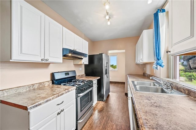 2959 Churchview Ave, Baldwin Boro, PA 15227 - kitchen featuring appliances with stainless steel finishes, under cabinet range hood, wood finished floors, and healthy amount of natural light