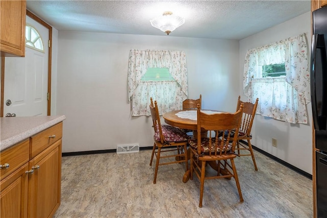 5731 Interboro, Lincoln Place, PA 15207 - dining space featuring a textured ceiling and light floors