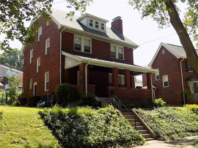 437 Green St, Munhall, PA 15120 - traditional style home with covered porch, a chimney, brick siding, stairway, and a front yard