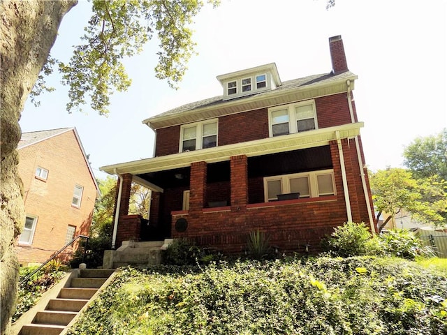 437 Green St, Munhall, PA 15120 - traditional style home with brick siding, stairs, a chimney, and a porch