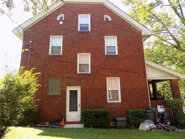 437 Green St, Munhall, PA 15120 - back of property featuring brick siding and a lawn