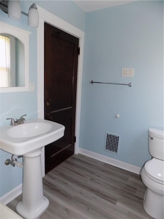437 Green St, Munhall, PA 15120 - half bath with wood finished floors