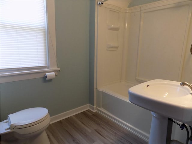 437 Green St, Munhall, PA 15120 - bathroom featuring wood finished floors and bathing tub / shower combination