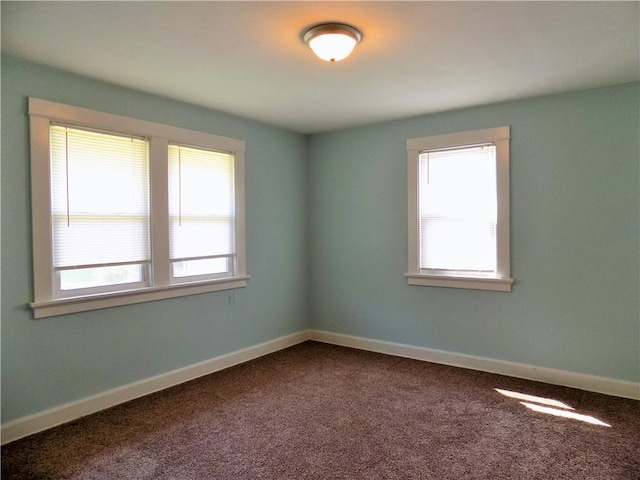 437 Green St, Munhall, PA 15120 - empty room with dark carpet and baseboards