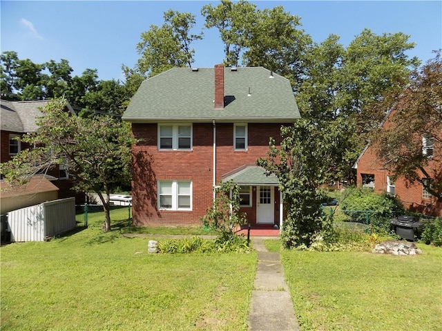 437 Green St, Munhall, PA 15120 - view of front of house with a chimney, brick siding, a porch, and roof with shingles