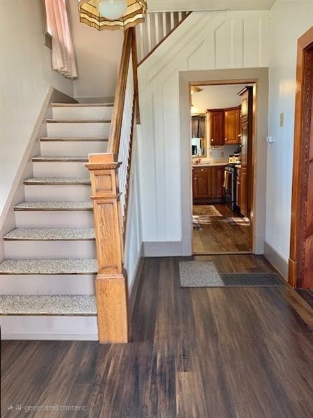 1117 Idaho Ave, Harrison Twp, PA 15065 - staircase featuring wood finished floors and baseboards