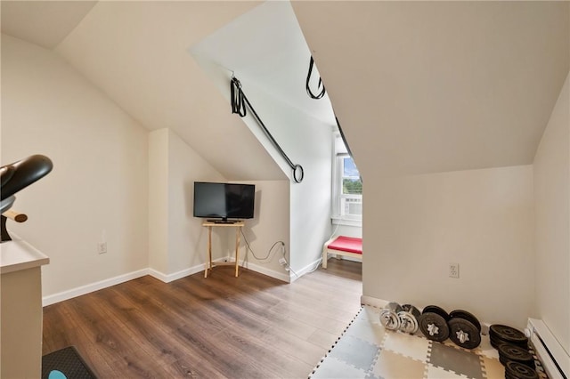 637 Bigelow St, Greenfield, PA 15207 - bonus room with a baseboard heating unit, vaulted ceiling, and wood finished floors