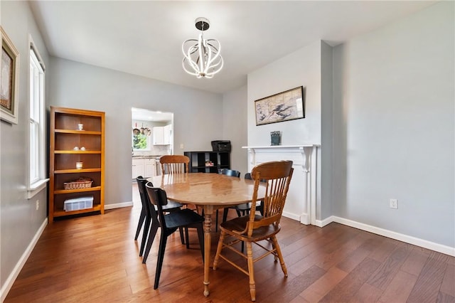 637 Bigelow St, Greenfield, PA 15207 - dining space with wood finished floors and a chandelier