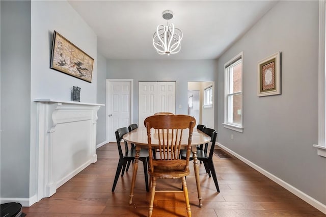 637 Bigelow St, Greenfield, PA 15207 - dining space featuring a chandelier and dark wood-type flooring