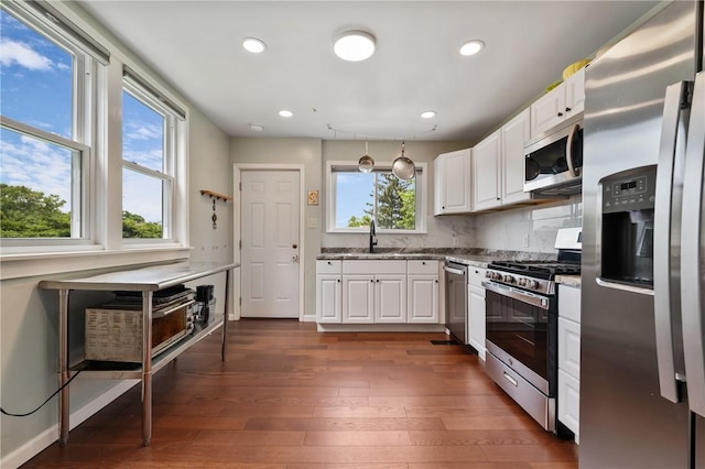637 Bigelow St, Greenfield, PA 15207 - kitchen with appliances with stainless steel finishes, white cabinets, dark wood finished floors, and recessed lighting
