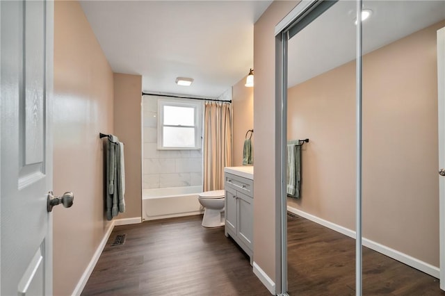 637 Bigelow St, Greenfield, PA 15207 - full bath featuring vanity, shower / bathtub combination with curtain, and wood finished floors