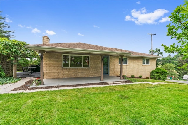 300 Jacks Run Rd, Ross Twp, PA 15202 - ranch-style home featuring a chimney, a patio area, a front yard, and brick siding