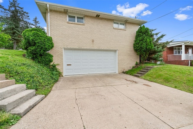 300 Jacks Run Rd, Ross Twp, PA 15202 - view of home's exterior featuring concrete driveway, an attached garage, and brick siding