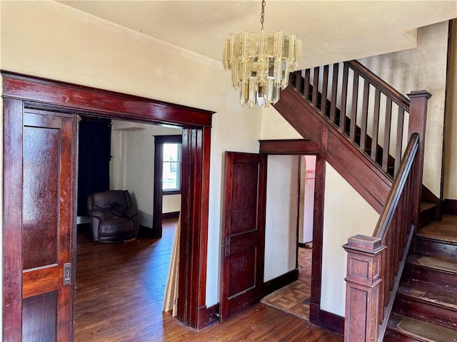 1413 Summit Ave, Monessen, PA 15062 - staircase featuring wood finished floors and a chandelier