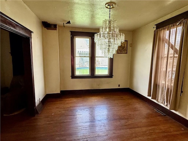 1413 Summit Ave, Monessen, PA 15062 - unfurnished dining area with a chandelier and wood-type flooring